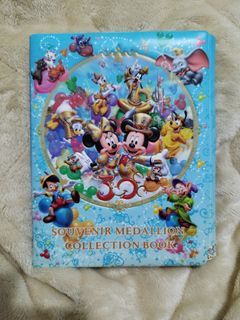 Souvenir Disney Medallion collection book