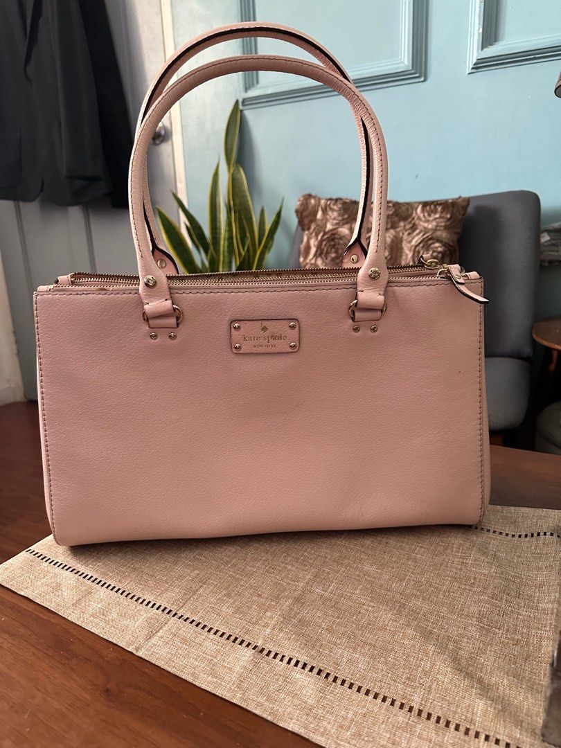 💯 % Original Kate Spade Leather Tote Bag (Category: Luxury Bags & Wallets) located in Quezon City. Submitted by fashion4less__ (Listing ID 1306230240, Image 1). Description: 💯 authentic in good condition with little stain inside (see photo #7) seldom used - na stock lang sa closet 🫰🏻 can be used as laptop bag color is baby pink, super cute yet spacious 🩷 super sale!!! .