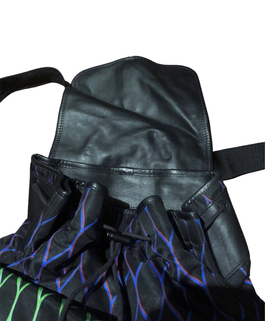 Kenzo x H&M Drawstring Multicolor Backpack (Category: Luxury Bags & Wallets) located in Dumaguete. Submitted by overthrifted (Listing ID 1306283457, Image 3). Description: Kenzo x H&M Drawstring Multi Color Backpack Large size 18width 16 height 7 length (measured ng nakatayo, ang length ay measured ng nasa ilalim) Authentic Retails at 10k plus Only issue is small chipped on the metal sa drawstring di naman makikita kasi nasa loob naman 2200 add s