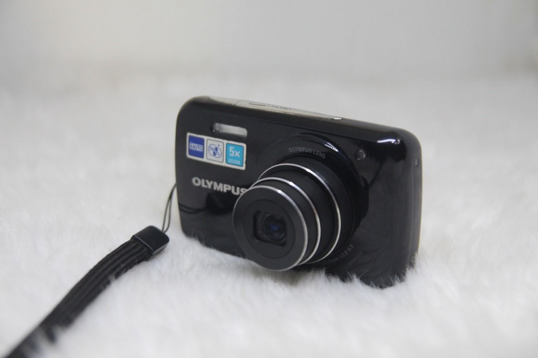 Olympus VH-210 Digital Camera 14 Megapixel 5x Optical Zoom (Category: Cameras) located in Manila. Submitted by ultimogizmos (Listing ID 1306294342, Image 3). Description: Olympus VH-210 Digital Camera 14 Megapixel 5x Optical Zoom About this item Including Charger, Lithium battery The compact VH-210 boasts a 14-megapixel camera, 26 mm wide angle lens and digital stabilisaion to guarantee sharp pictures in all conditions.The3" LCD screen puts you i