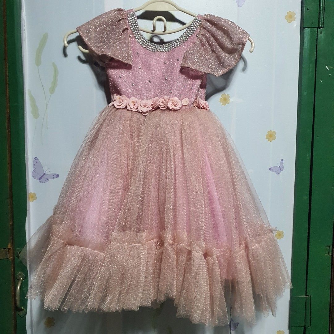 Preloved Kid's gown (Category: Babies & Kids Fashion) located in Ilagan. Submitted by micassandra (Listing ID 1306330018, Image 1). Description: Preloved gown Needs washing and repair (one missing rose) Shown in the photos.