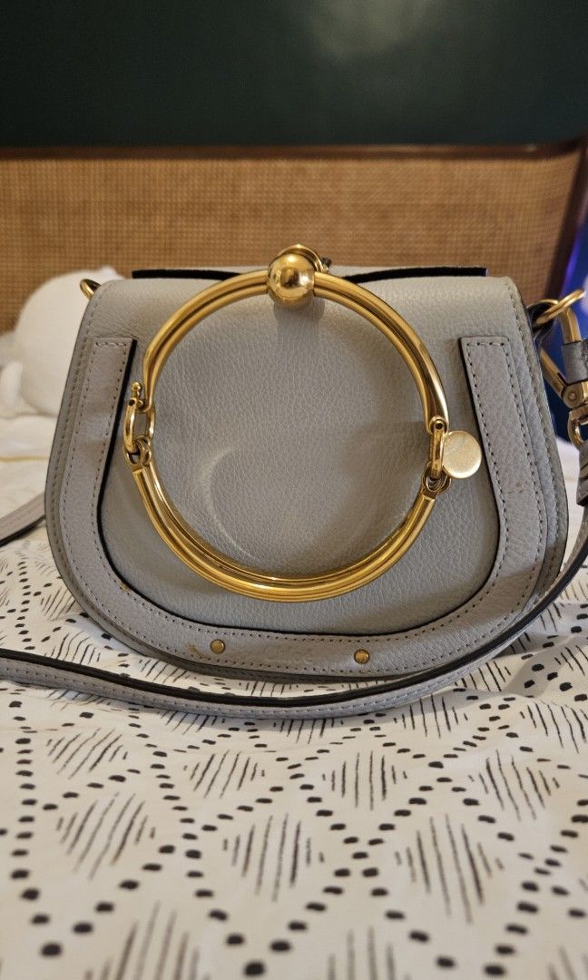 Rare Chloe Nile Bracelet Bag (Category: Luxury Bags & Wallets) located in Manila. Submitted by grandowl.31fcd8 (Listing ID 1306225407, Image 1). Description: resale value is usually around 23k. Selling for low bc need funds ASAP! Authentic with dust bag, flaws are minor and are only signs of age (8 yr old bag) No water stain or indelible marks. Metal handle is without scratch. Still negotiable..