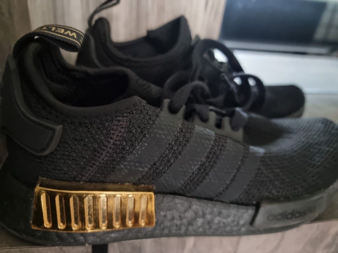 Nmd black gold deals