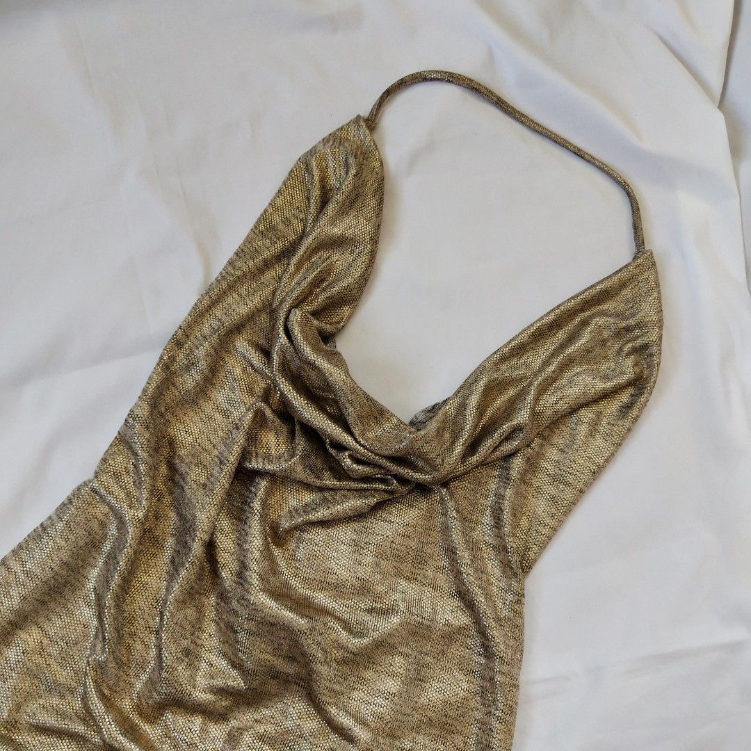 Backless cowlneck metallic party dress (Category: Dresses) located in Makati City. Submitted by denise.syy (Listing ID 1301632613, Image 2). Description: has a really high slit on both sides thats why i had it stitched para the slit wont be revealing masyado. only worn once for a photoshoot :).