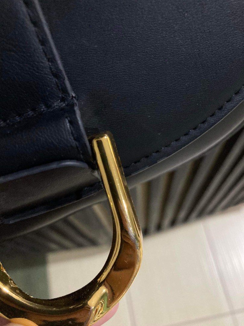 Black Crossbody/Shoulder Saddle Bag (Category: Cross-body Bags) located in Kalibo. Submitted by 97blnk (Listing ID 1301543123, Image 2). Description: • See second pic for flaw. Not noticable naman. • Just needs cleaning. • No orange app checkout. • Gcash/bank transfer (China Bank Savings).