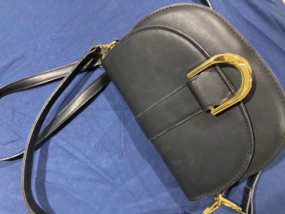 Black Crossbody/Shoulder Saddle Bag (Category: Cross-body Bags) located in Kalibo. Submitted by 97blnk (Listing ID 1301543123, Image 3). Description: • See second pic for flaw. Not noticable naman. • Just needs cleaning. • No orange app checkout. • Gcash/bank transfer (China Bank Savings).