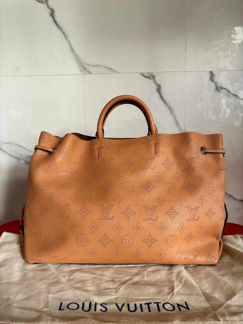LV Manina Two Way Bag (Category: Luxury Bags & Wallets) located in Cebu City. Submitted by day.98 (Listing ID 1301629471, Image 2). Description: japan preloved selected from japan surplus mahina leather, genuine coded no flaws.