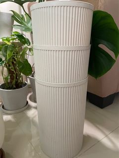 Tall white plastic pot for plants
