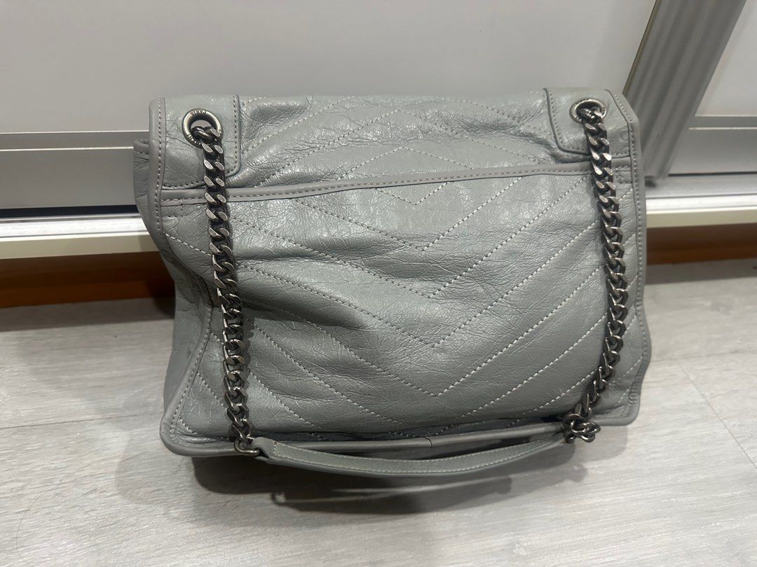 Ysl Saint Laurent Niki Bag (Category: Luxury Bags & Wallets) located in Makati City. Submitted by luxedeclutter (Listing ID 1301653306, Image 3). Description: The Niki Medium shoulder bag from Saint Laurent resurrects motifs from the label’s iconography to create a covetable investment piece, this style comes in vintage crinkled calfskin leather for an aged effect, with chevron stitching that’s become symbolic for the brand. Our favorite detail, 