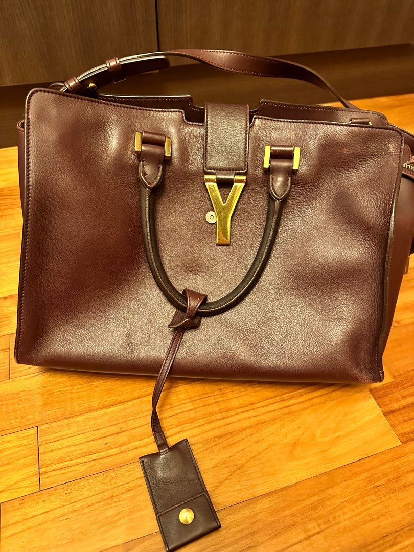 Authentic Saint Laurent bag (Category: Bags & Wallets) located in Singapore. Submitted by fleur_k (Listing ID 1301809729, Image 1). Description: Heavily used bag. Purchased over $4k. Buy if you are comfortable with the condition. I believe colouring and bag spa can give a new look .