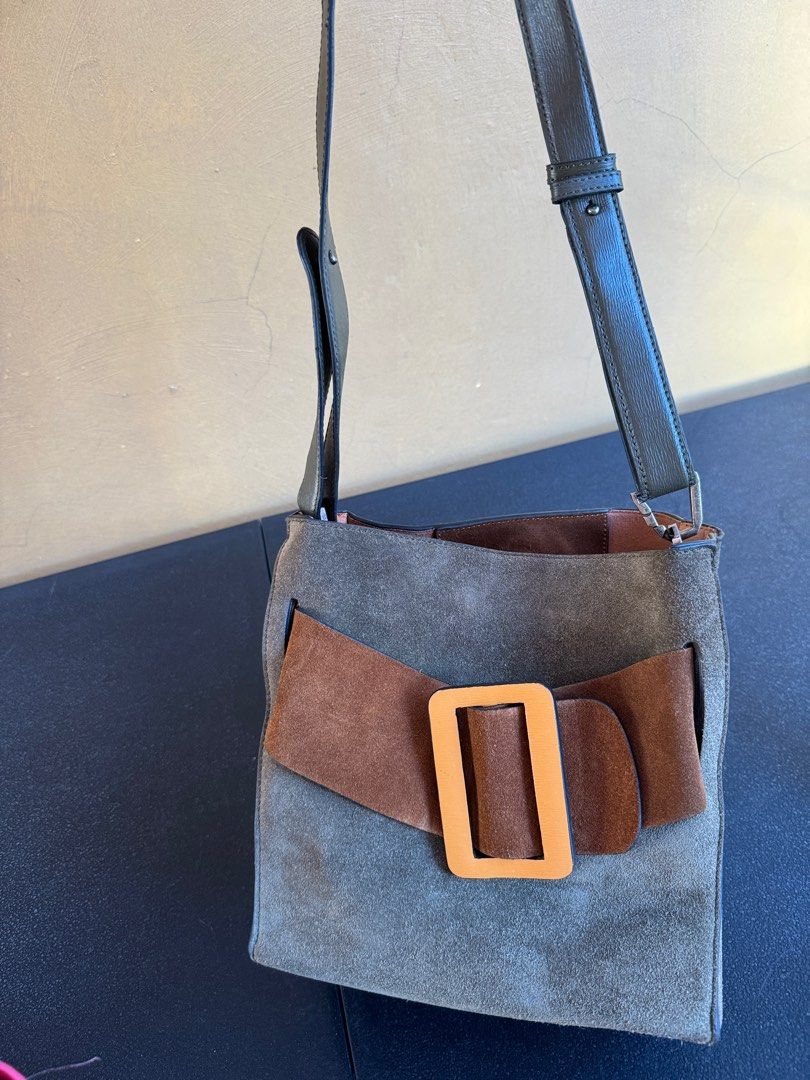 Boyy Devon Suede bag (Category: Luxury Bags & Wallets) located in Cavite. Submitted by zen_nikki724 (Listing ID 1301759301, Image 2). Description: Kindly see photos to see condition of the bag. Boyy Devon Suede bag. Suede material With Boyy tag, zipper. Used condition No inclusions. Only the bag itself. Bag Issues: 1. Missing handle strap, only the sling is available as shown in the photo. 2. Rubber lining & peeling issues on the sling strap & li
