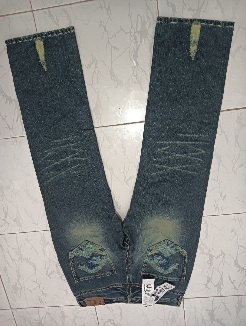 Brand New Big train embroidery wave design (Category: Jeans) located in Cebu City. Submitted by doblas123 (Listing ID 1301678650, Image 1). Description: 36 waistline 44 length 9.5 inches hem tattered design.