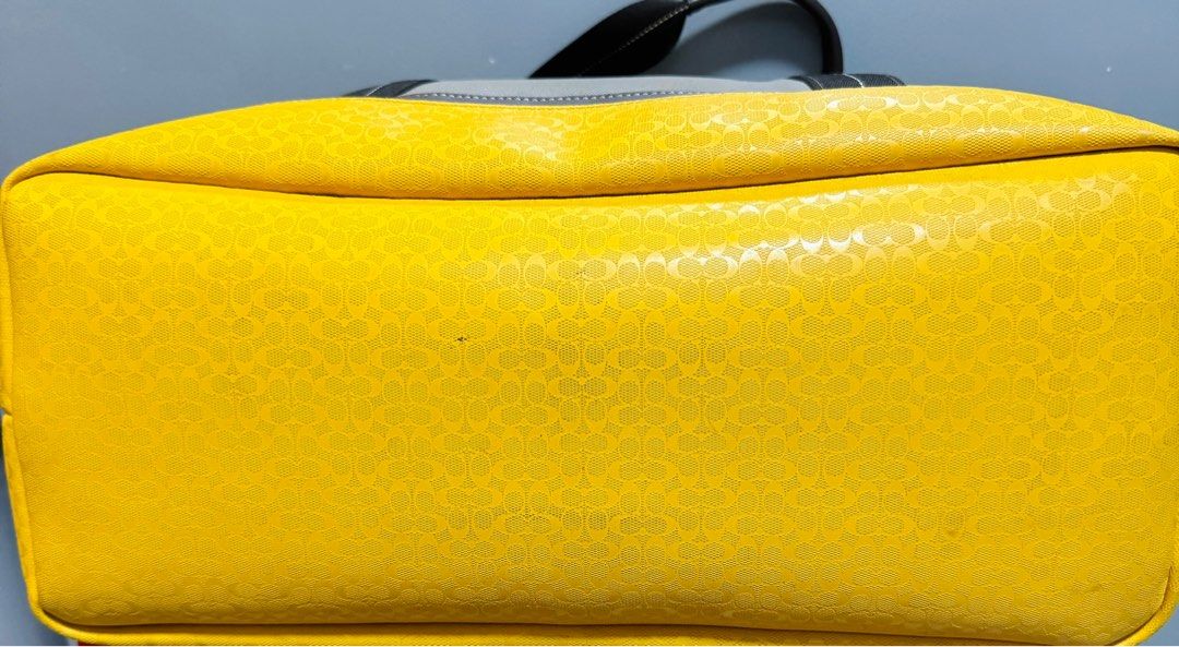 COACH (Category: Luxury Bags & Wallets) located in Quezon City. Submitted by TGDL123 (Listing ID 1301821378, Image 3). Description: Coach weekend travel bag XL canvas taupe with yellow coated accent and FREE pouch 12x13x7” Note: see minor marks.