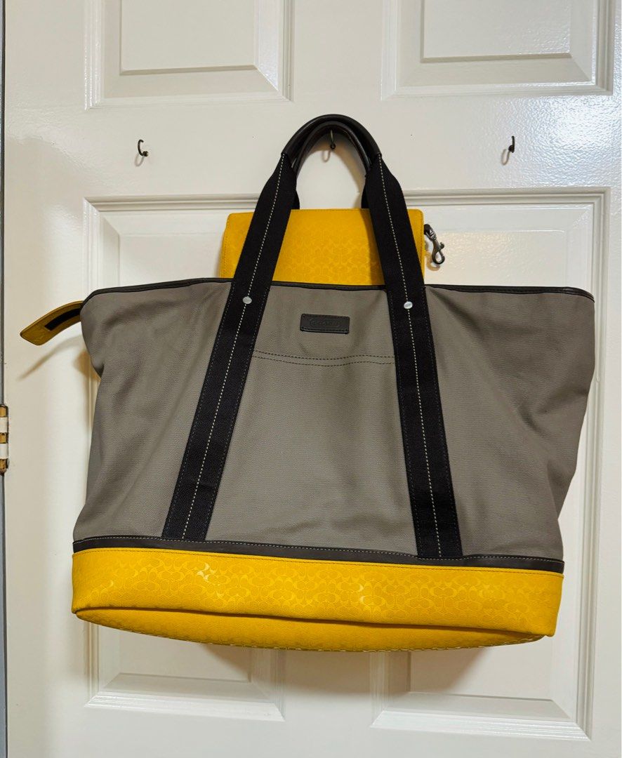 COACH (Category: Luxury Bags & Wallets) located in Quezon City. Submitted by TGDL123 (Listing ID 1301821378, Image 1). Description: Coach weekend travel bag XL canvas taupe with yellow coated accent and FREE pouch 12x13x7” Note: see minor marks.