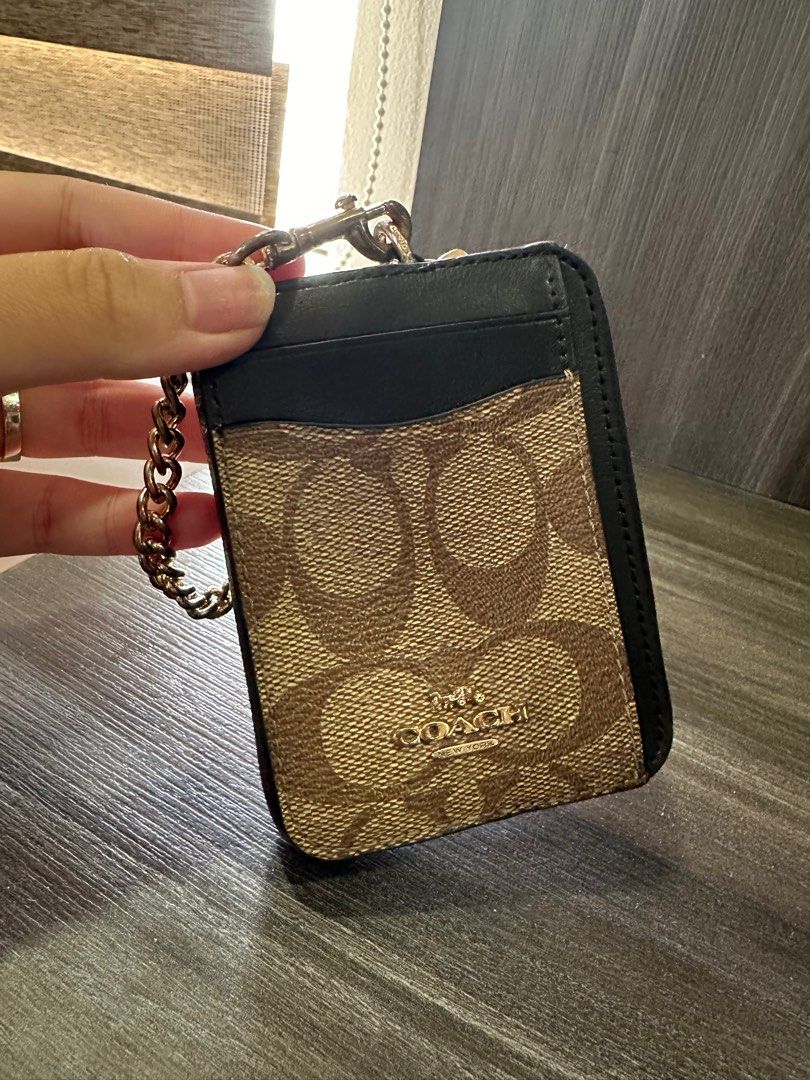 Coach Cardholder (Category: Luxury Bags & Wallets) located in Quezon City. Submitted by danielascaaa (Listing ID 1301714571, Image 2). Description: ✅ Multifunctional small wallet! You can also attach your keys on the chain 😍 ✅ No inclusions, guaranteed authentic. Bought this in the US ✅ With slight tarnishing but no scratches on edges ✅ Made of Leather and Canvass ✅ This can HOLD A LOT 😍 Cards, bills, even coins! LAST PRICE POSTED. LOWBALLERS W