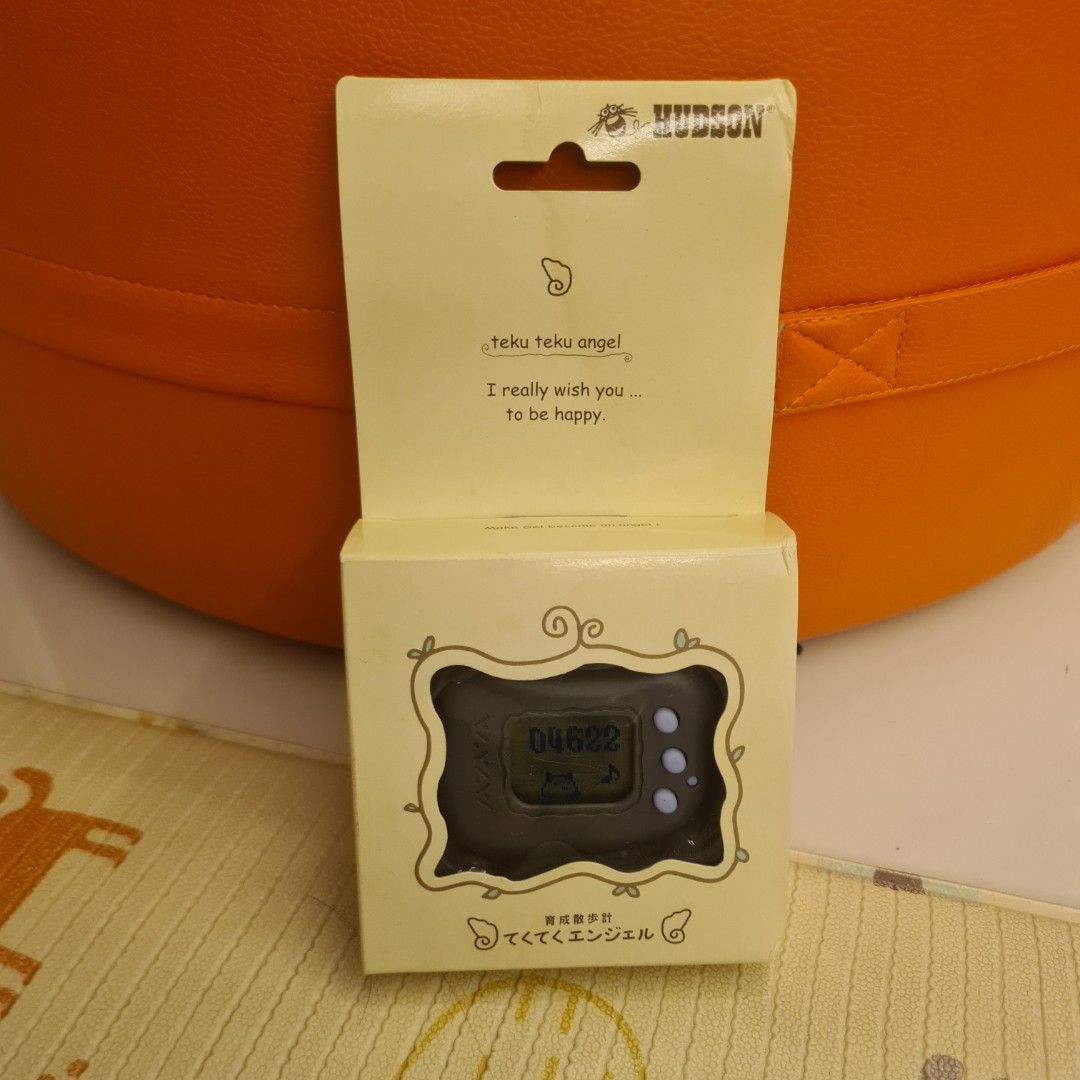 FREE TRACKABLE SHIPPING AND NEW AND UNUSED! Rare 1997 Vintage Teku Teku Angel Hudson Pedometer Cum Tamagotchi Electronic Virtual Pet Game (Category: Vintage Collectibles) located in Singapore. Submitted by doraguy (Listing ID 1301761368, Image 1). Description: Teku Teku Angel is a series of games that combine the function of a pedometer with that of a virtual pet. Accumulate points with your progress of usage of the pedometer function and use the