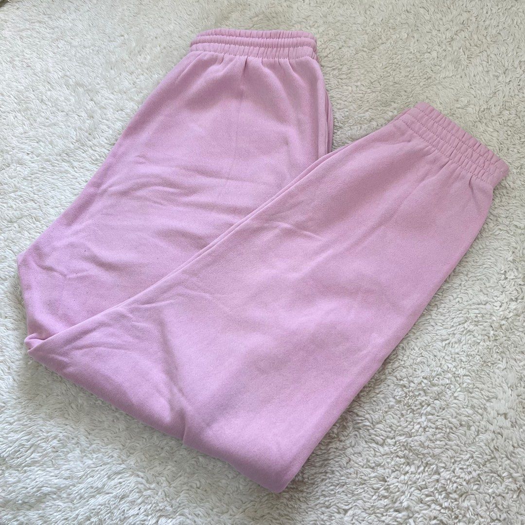 H&M pink sweatpants / joggers (Category: Other Bottoms) located in Manila. Submitted by ideclutterss (Listing ID 1301699420, Image 2). Description: Breathable thick cotton fabric, fleece fabric on the inside, and can fit XS-S rfs: decluttering mod: j&t / sdd lalamove.