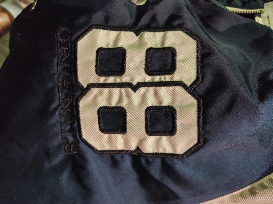 Jack & Jones Bomber Jacket (Category: Coats, Jackets and Outerwear) located in Quezon City. Submitted by chambie0426 (Listing ID 1301801201, Image 3). Description: Brand: Jack & Jones Color: Navy Blue & White (2 tone) Size: L on tag Dimes: 23 width by 26 length Condition & Color rate: 9.3/10 Honest issue: Lints but already removed, washable stain & needs wash Authenticity: Legit Additional details: Embroidered logos, engraved brand on every butto