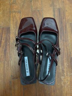 Medium round toe burgundy sandals with a 1 inch heel