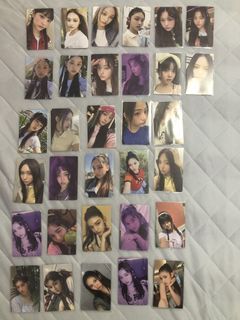 Newjeans photocards and unsealed album