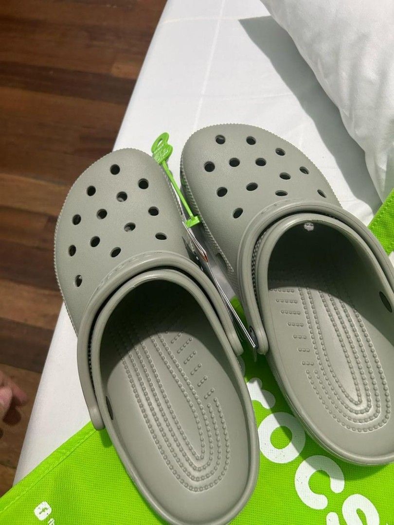 Original Crocs (Category: Slippers & Slides) located in Manila. Submitted by gingercrumbs (Listing ID 1301794482, Image 3). Description: Selling brand new crocs w/ tag. Bought 3290 RFS: Wrong size Price is still negotiable.