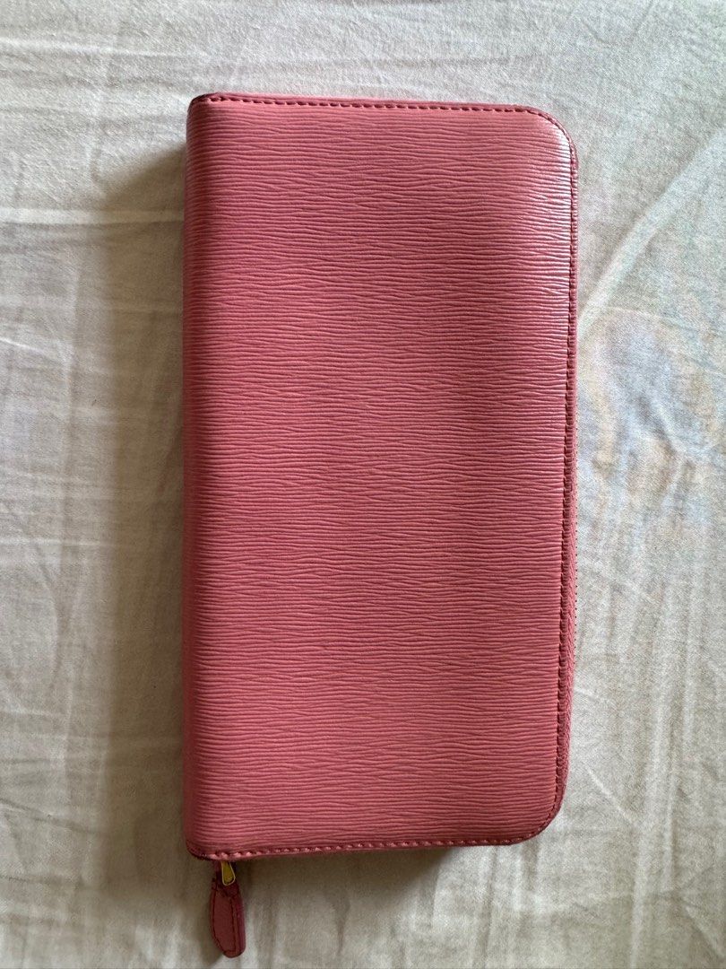 Prada Vitello Pink Long Zip wallet (Category: Luxury Bags & Wallets) located in Pasay City. Submitted by iamkatrisse11 (Listing ID 1301735729, Image 2). Description: (authentic) Prada Vitello Pink Long Zip wallet -heavily used -payment via gcash/bank transfer -shipping c/o buyer.