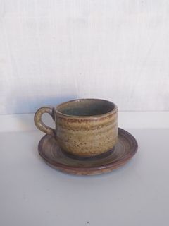 Rustic stoneware mug and saucer