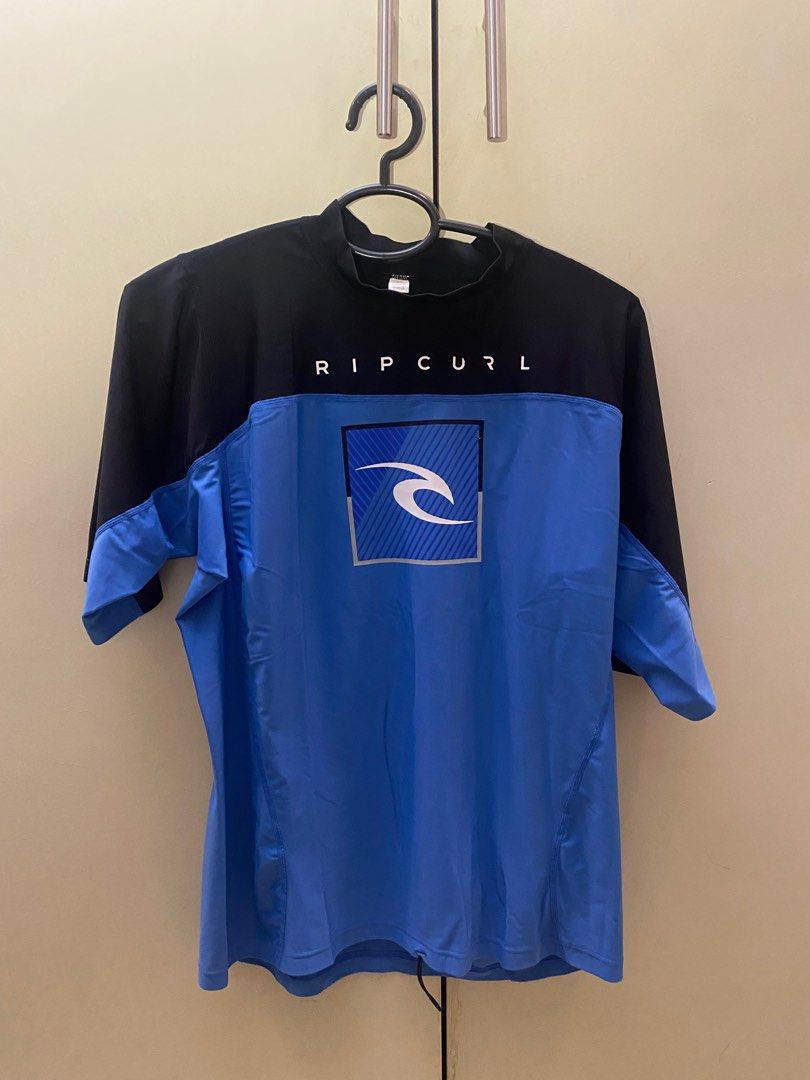 RIPCURL - Swimming Shirt (men) (Category: Activewear) located in Pasig City. Submitted by nicoloplana (Listing ID 1301879805, Image 1). Description: Original and well used Ripcurl shirt for swimming. Made of the typical material used for swimming. No damages, print is in good condition RFS: No longer being worn. Making space.