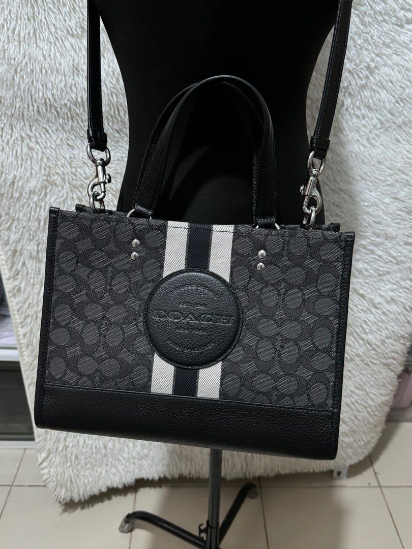 Coach dempsey caryall black (Category: Luxury Bags & Wallets) located in Pasig City. Submitted by jackie_ginger (Listing ID 1302211149, Image 2). Description: Onhand with tag and care card 💯orig from US.
