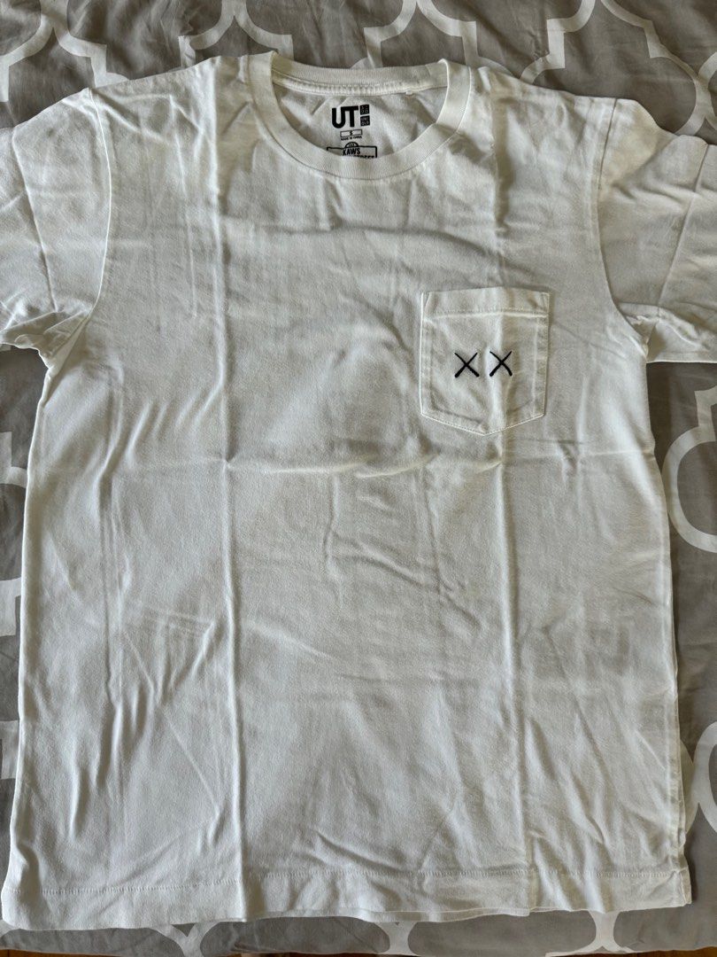 KAWS x Uniqlo UT Shirt (Category: Tshirts & Polo Shirts ) located in Quezon City. Submitted by teaandbiscuits (Listing ID 1302072990, Image 2). Description: like new, no tags shoulder to shpulder 16in pit to pit 17.5in length 24in.