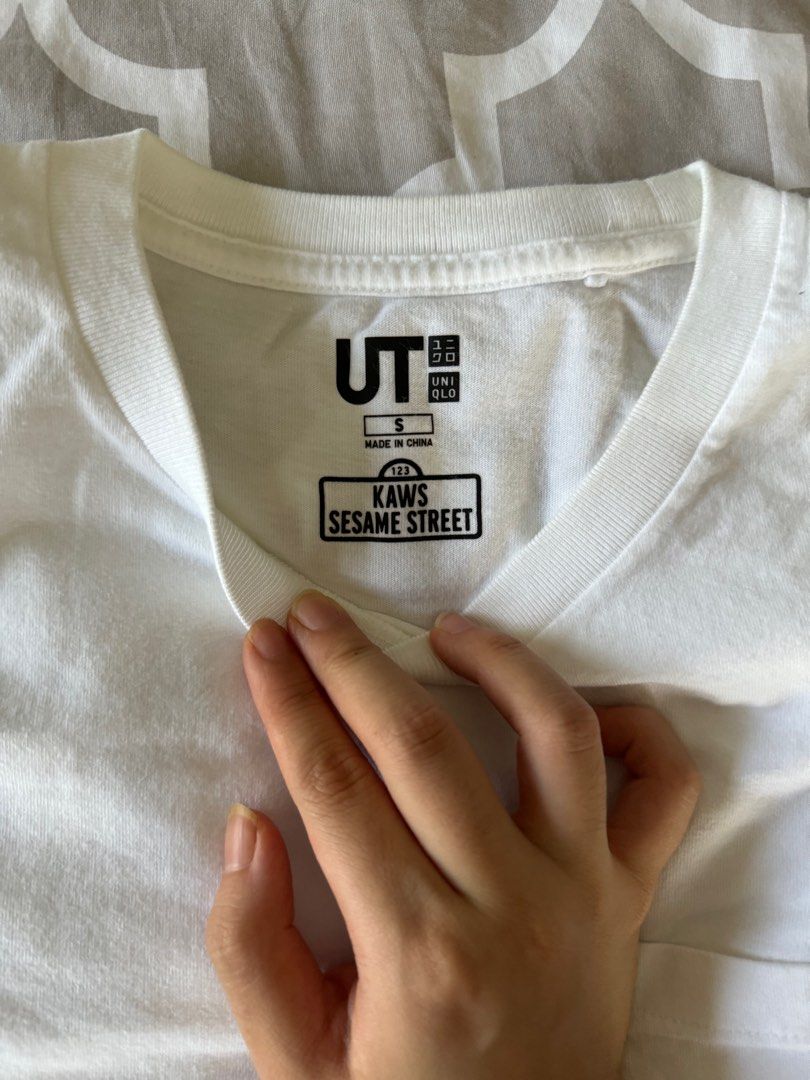 KAWS x Uniqlo UT Shirt (Category: Tshirts & Polo Shirts ) located in Quezon City. Submitted by teaandbiscuits (Listing ID 1302072990, Image 3). Description: like new, no tags shoulder to shpulder 16in pit to pit 17.5in length 24in.