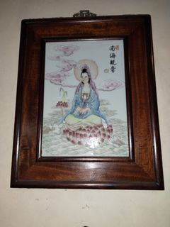 Kuan Yin ceramic framed in wood