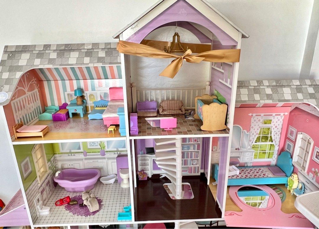 Giant wooden barbie doll house with very cute wooden furnitures in it