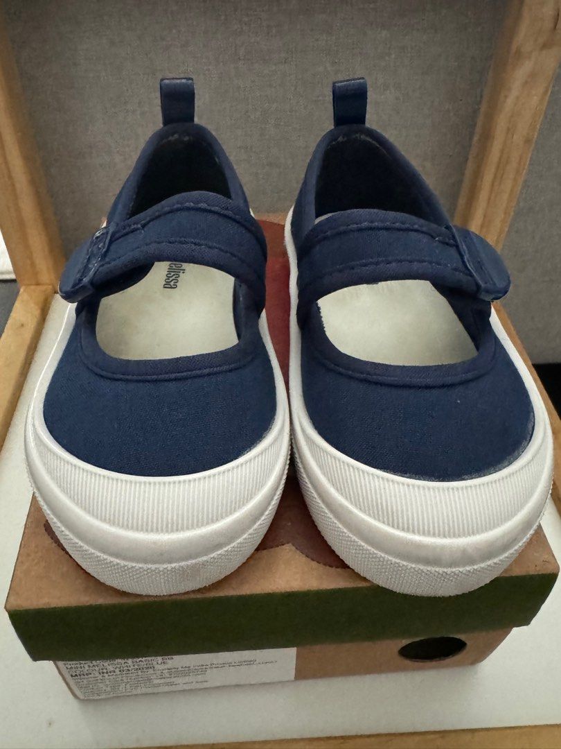 MINI MELISSA BASIC in Size 09 (Category: Babies & Kids Fashion) located in Singapore. Submitted by redishme (Listing ID 1302172921, Image 1). Description: Selling lightly used mini melissa shoes in size 9, white blue. Very good condition in box..
