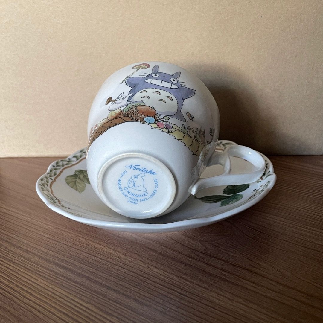 My Neighbor Totoro Noritake Tea Cup (Category: Coffee & Tea Tableware) located in Pasig City. Submitted by aikayamaguchi (Listing ID 1302106346, Image 2). Description: My Neighbor Totoro Noritake Tea Cup — 2 cups available — Php 1,000/each — Strictly sold as set only — Pre-loved / Second hand — Tea cup measures approx: (D) 3.6 inches (L) 5 inches (H) 9.4 inches — Tea cup comes with a Noritake Royal Orchard saucer — Saucer measures approx: 6 inche
