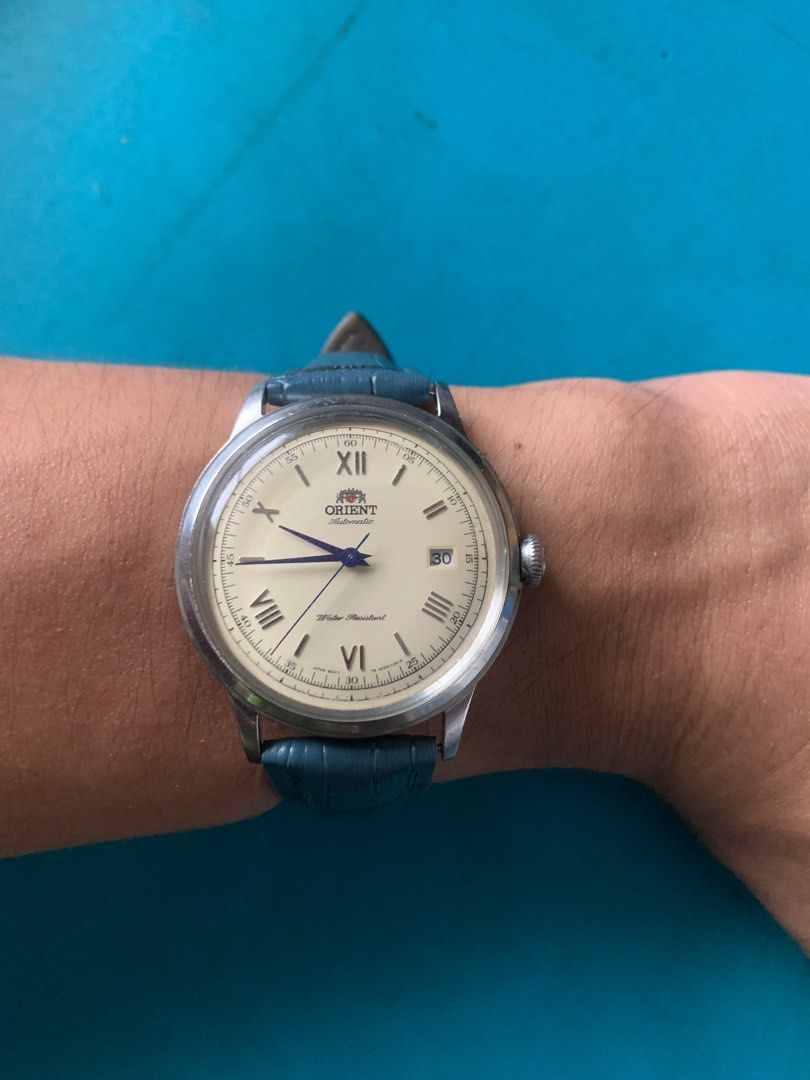 Orient Bambino V2 Cream dial (Category: Men's Watches) located in Naga. Submitted by xkenzero7x (Listing ID 1302108962, Image 1). Description: 10k (freeship) pwedi COD/Cash on Delivery pag malayo via LBC Orient Bambino V2 Cream dial -Japan Automatic movement w/hacking and hand winding -Mineral Domed Crystal -Cream dial w/ blue handset -Water resistant -Stainless steel - Mint condition -Unbuff case -All Original watch head -AM Blue leather strap.