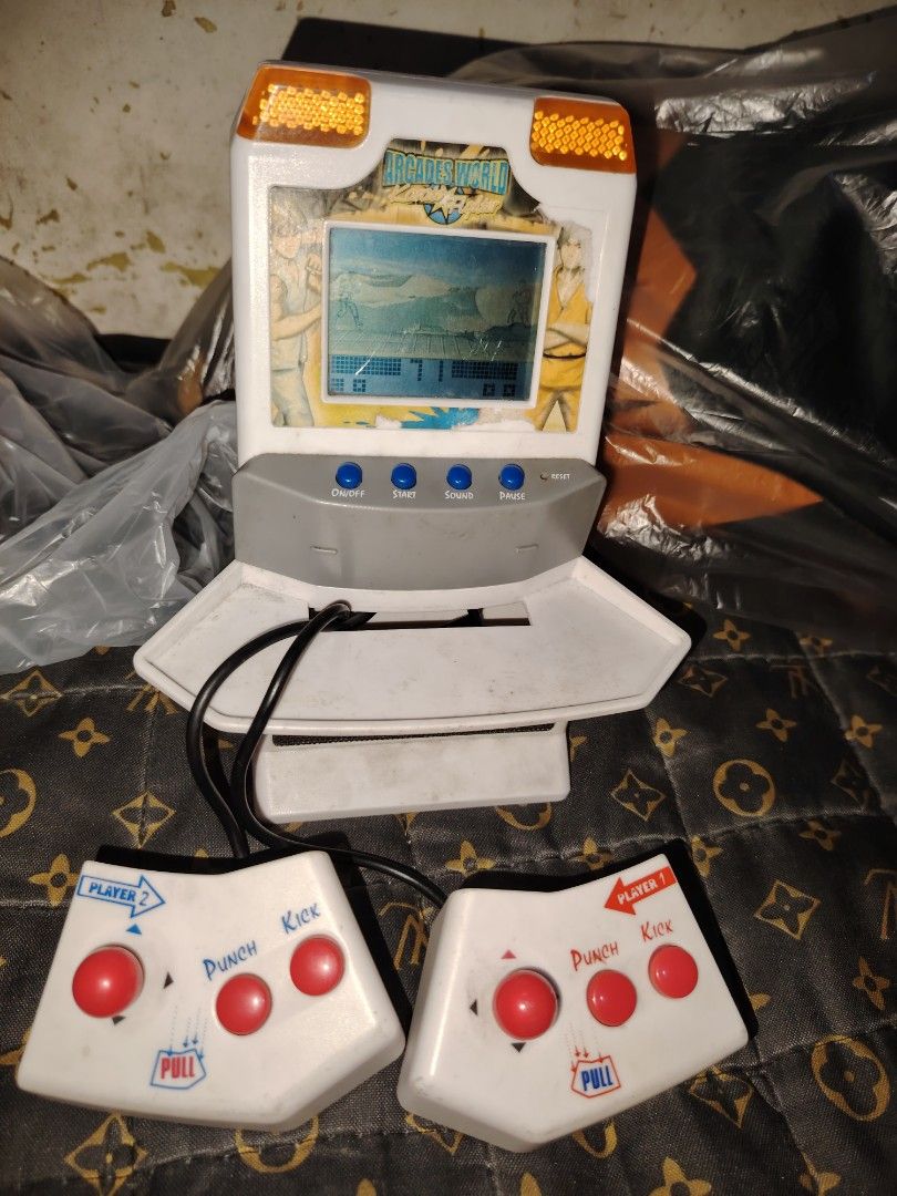 VINTAGE Arcades World Karate Fighter Small Game Console (Category: Controllers) located in Caloocan City. Submitted by mazed22 (Listing ID 1302153666, Image 1). Description: Arcades World Karate Fighter Small Game Console Working with sounds Flaws no battery cover as you can see in the picture.