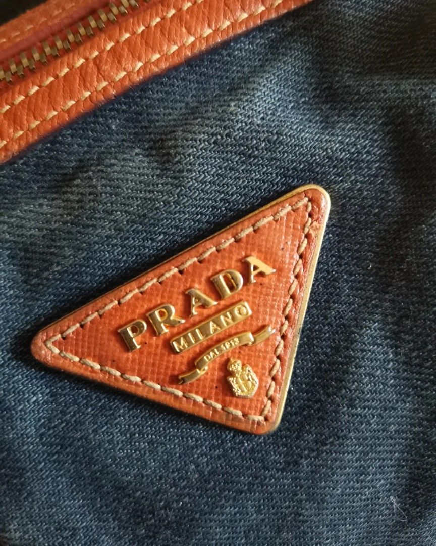 💯% Authentic Prada Denim Bauletto (Category: Luxury Bags & Wallets) located in Paranaque City. Submitted by luxehuntsmla.bymari (Listing ID 1302293914, Image 2). Description: 💯% Authentic Prada Denim Bag 🔸Excellent Used conditon 🔸Rank AB 🔸Bag and sling only P13500 only 🔸All items posted are guaranteed authentic or your money-back if proven fake by a legitimate authenticator. 👉Will no longer entertain questions that are already answered in 