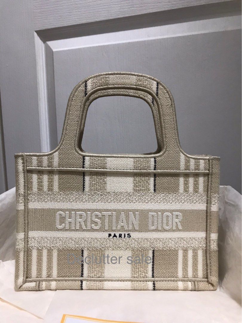 Authentic Dior Book Tote Mini Canvas Authentic with Entrupy certificate (Category: Luxury Bags & Wallets) located in Taguig. Submitted by shop.my.personal.collection (Listing ID 1302264941, Image 1). Description: Dior mini book tote in beige canvas. The cheapest you’ll find in the authentic designer market. Complete with original Dior dust bag, box, paper bag, authenticity card and Entrupy certificate See and buy it here: Mini Book Tote in Beige 