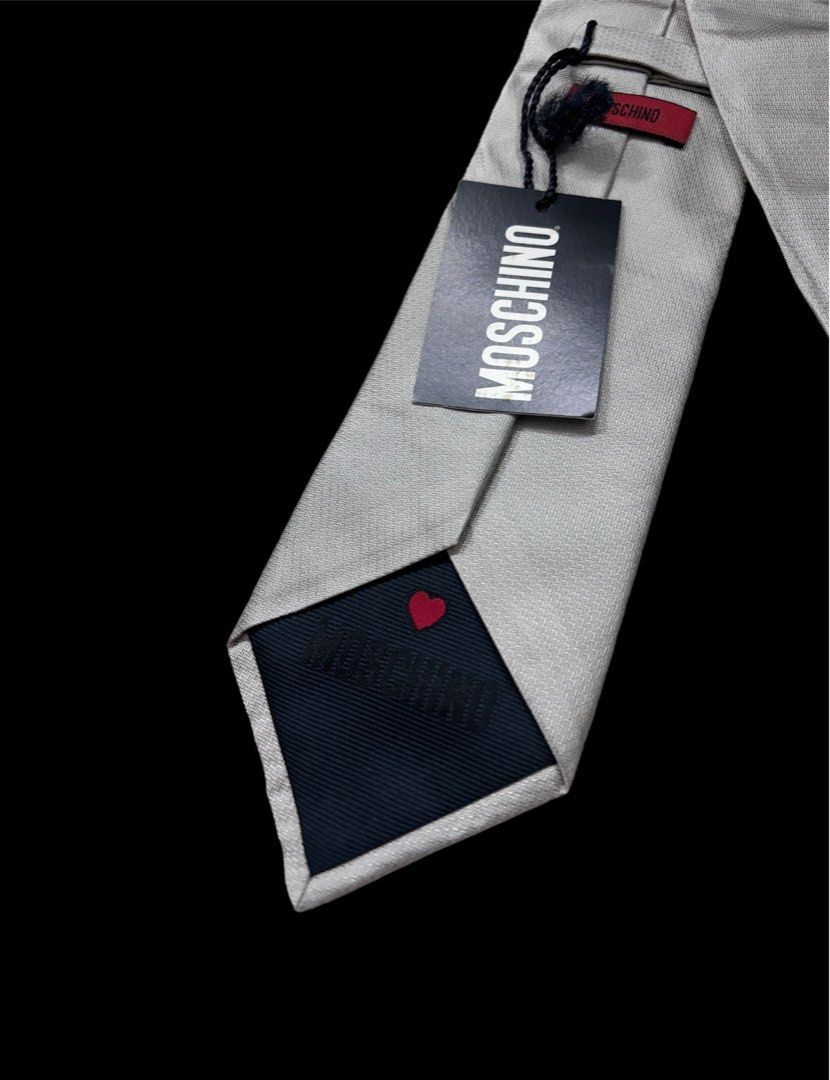 MOSCHINO NECK TIE (Category: Sets & Coordinates) located in Taguig. Submitted by j.gloria (Listing ID 1302282505, Image 2). Description: MOSCHINO GEOMETRICAL LOGO SILK TIE ITALY 59" / 3.7" GRAY IN COLOR BRAND NEW CONDITION WITH TAG.
