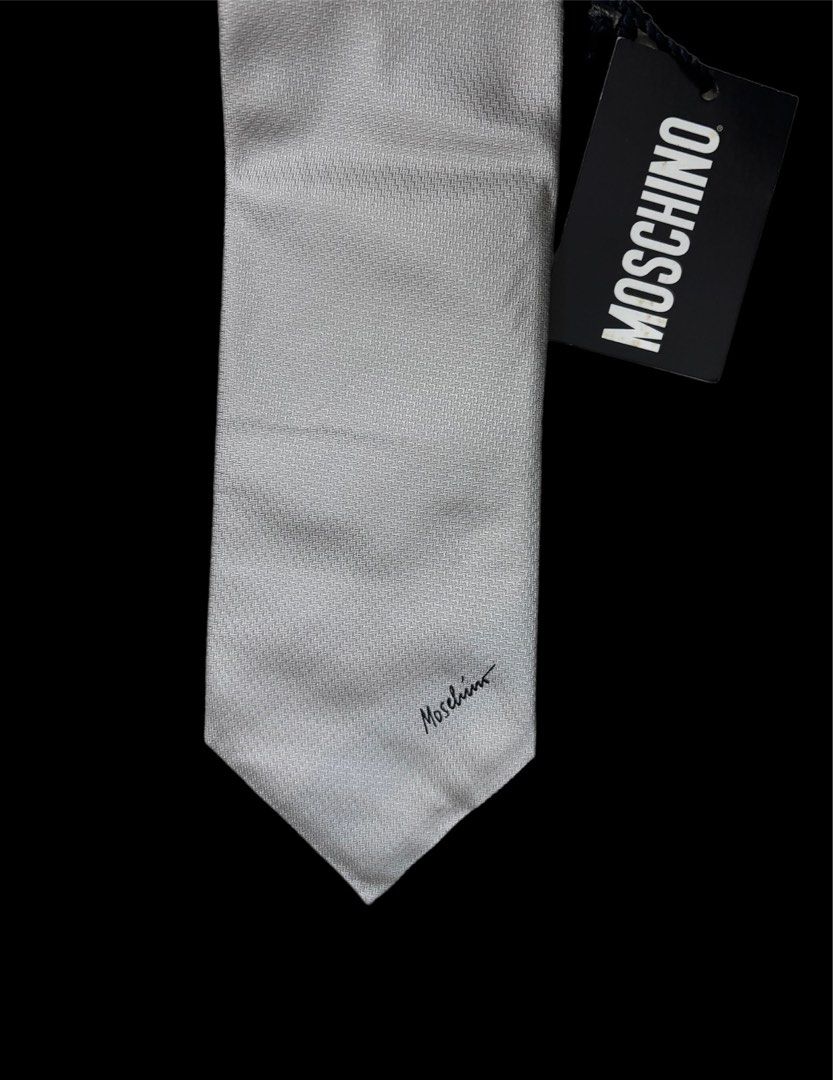 MOSCHINO NECK TIE (Category: Sets & Coordinates) located in Taguig. Submitted by j.gloria (Listing ID 1302282505, Image 3). Description: MOSCHINO GEOMETRICAL LOGO SILK TIE ITALY 59" / 3.7" GRAY IN COLOR BRAND NEW CONDITION WITH TAG.