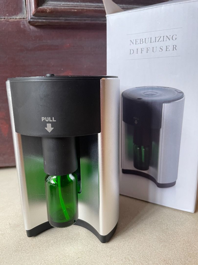 Nebulizing Diffuser (Category: Home Fragrance) located in Singapore. Submitted by wanderfairy (Listing ID 1302346237, Image 2). Description: Brand new nebulizing diffuser. Waterless, hence maintaining the pure therapeutic benefits of the essential oil. Comes with an extra essential oil bottle..