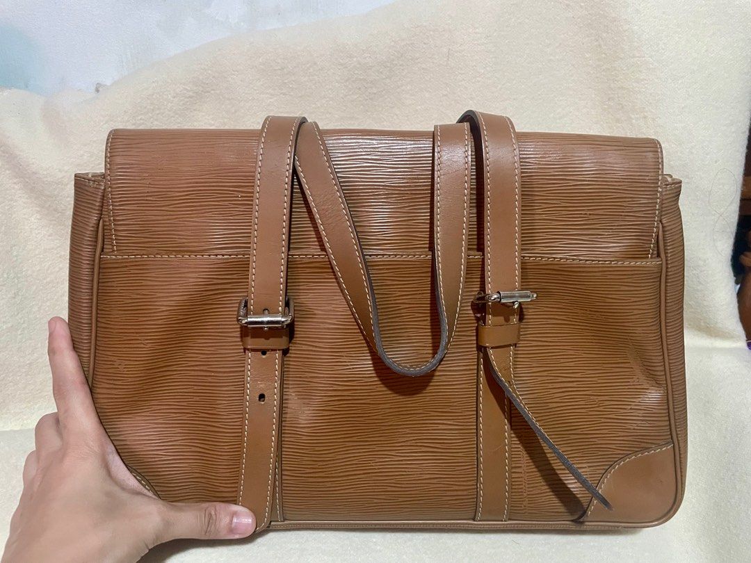 LV Epi segur MM (Category: Luxury Bags & Wallets) located in San Pablo. Submitted by prelovedbymistyblue (Listing ID 1302391259, Image 3). Description: Authentic LV epi Shoulder bag. Comes with dust bag and care cards. Adjustable belt type handle. With signs of use on the epi leather. Measures 13.9 x 9.5 inches. Selling low for 25500, down to 24000, then 22,000. Code: AR1016 RFS: too many bags, need to declutter .