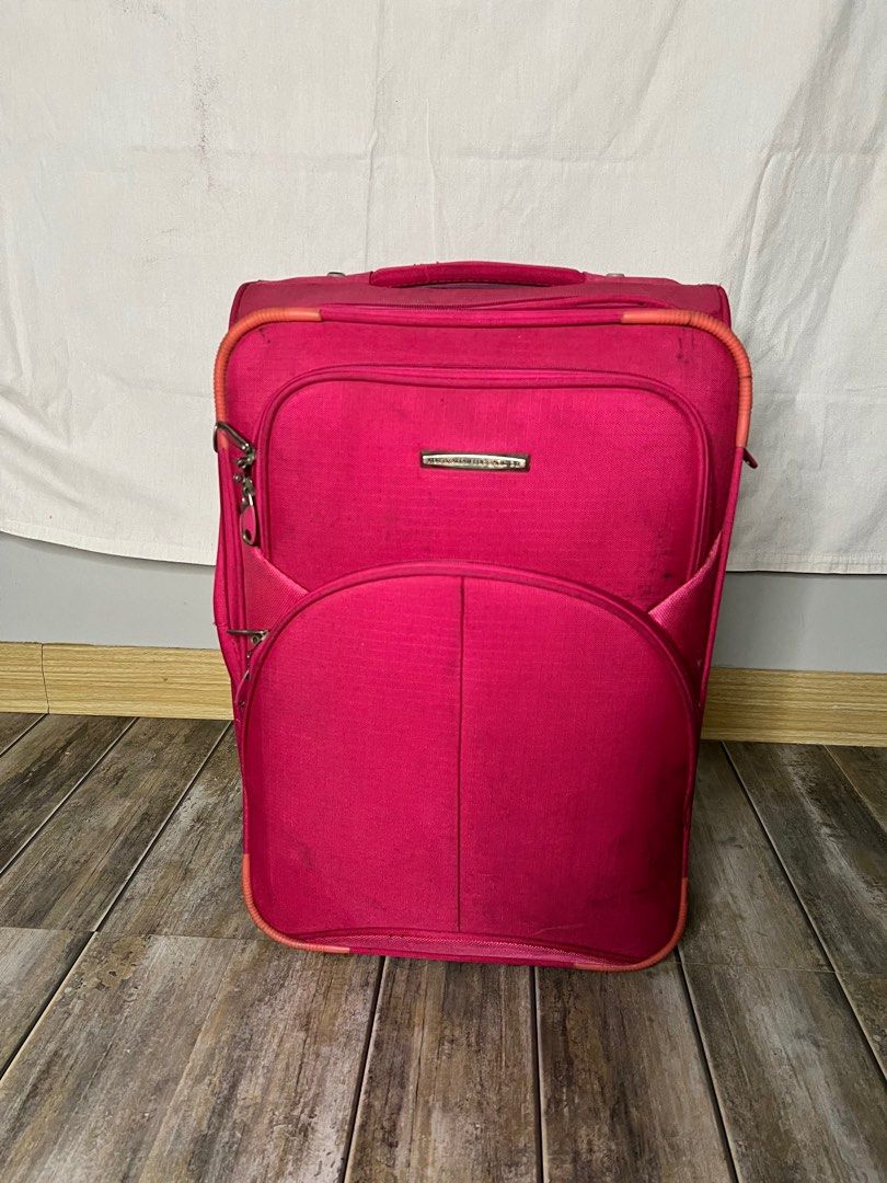 Pink luggage carry on (Category: Luxury Bags & Wallets) located in Quezon City. Submitted by miahranises0028 (Listing ID 1302518362, Image 1). Description: Hardwares are still in good condition. Scuffs and scratches here and there and needs cleaning. No issues in the handle still very sturdy and reliable. Australian brand. Clothes inside are not included. For reference only..