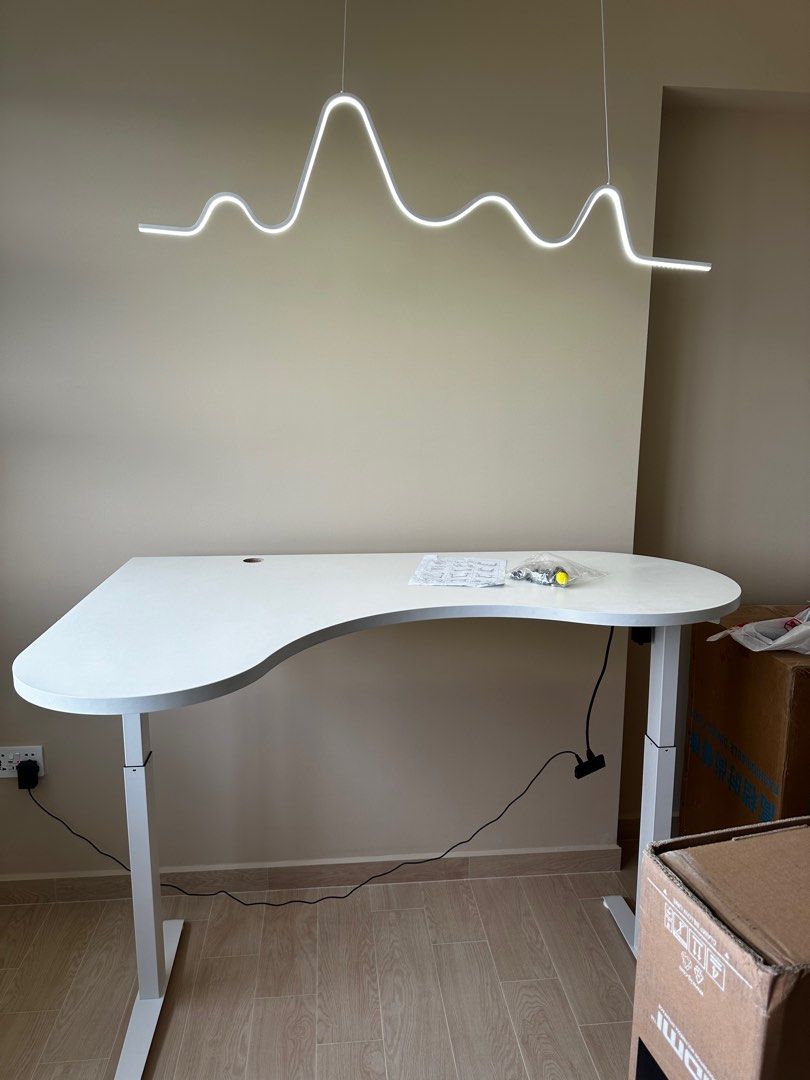 Adjustable computer desk (Category: Tables & Sets) located in Singapore. Submitted by sameer.goodkid (Listing ID 1306016465, Image 1). Description: Auto adjustable tablet up to 110 cm adjustable height. Cool looking highly functional table. Also can customize. Wooden table and metal frame. Need to pre order.
