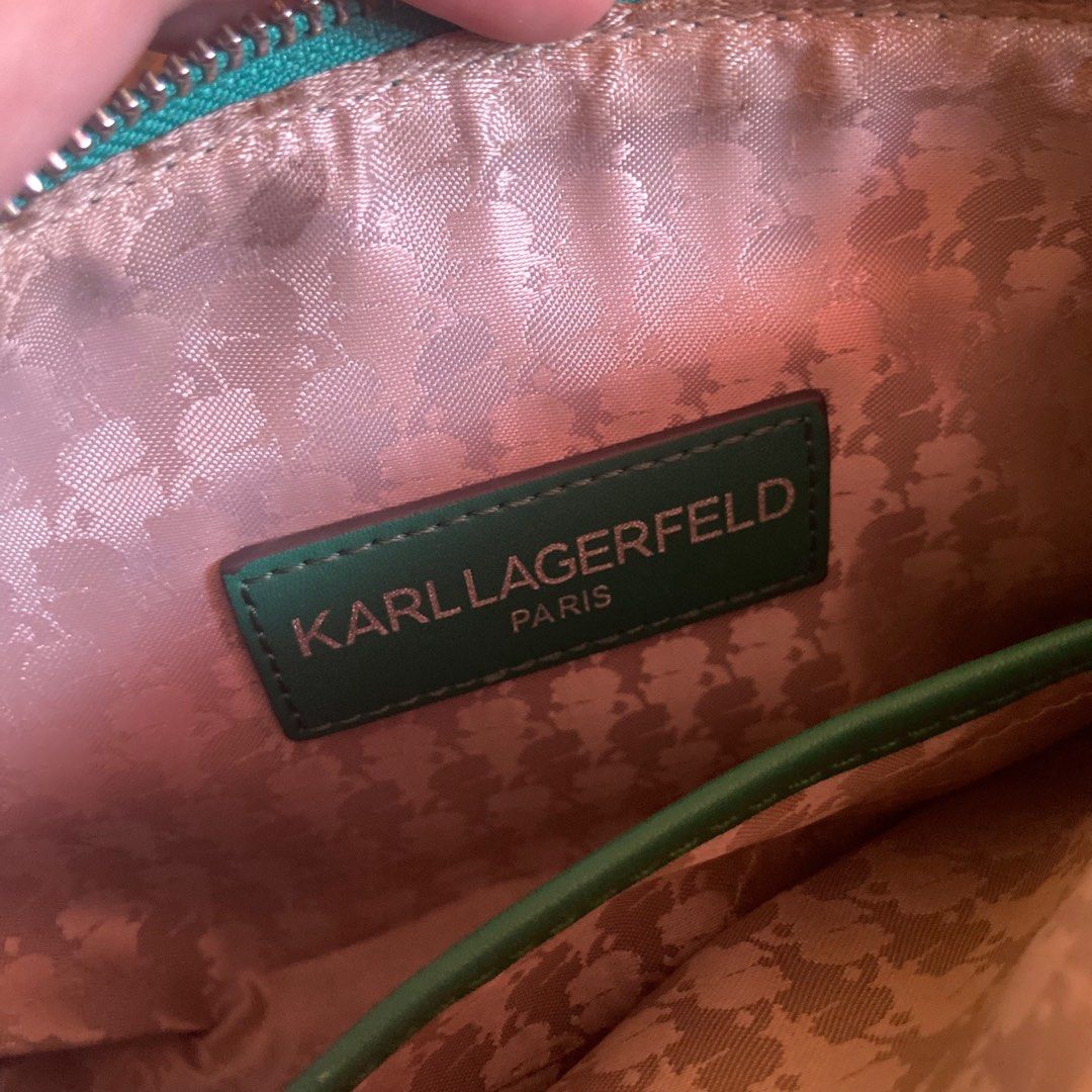Karl Lagerfeld Green Bow Small Shoulder Bag (Category: Luxury Bags & Wallets) located in Marikina City. Submitted by mlffy (Listing ID 1306067596, Image 2). Description: ☘️ Authentic Karl Lagerfeld Paris Genuine Leather Small Shoulder Bag ☘️ Emerald green bow statement detail ⛓️‍💥 Silvertone, chain sling 🛍️ Excellent condition with few to no signs of usage minimal flaw on rubber lining (1st photo) 💚 SRP was at 120 USD, RFS only decluttering! �