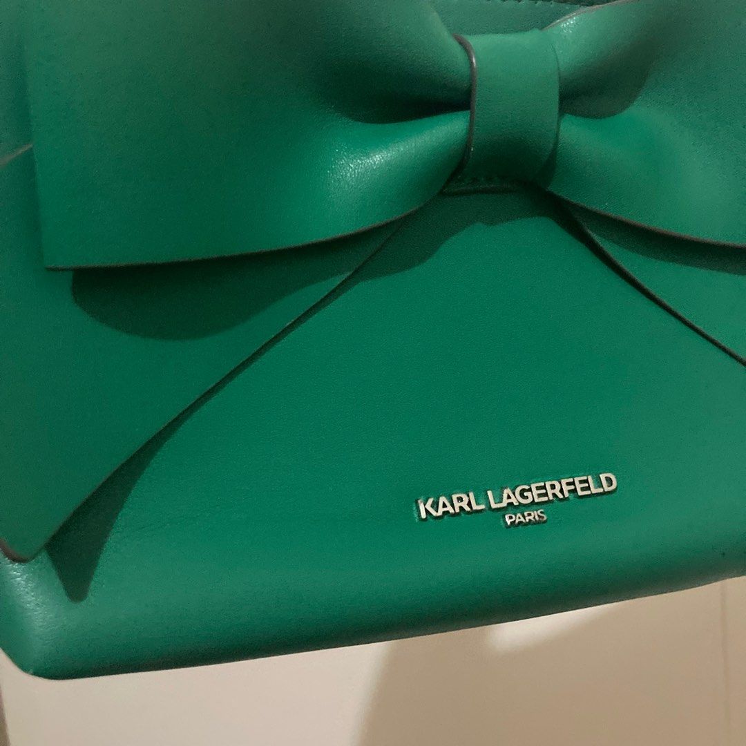 Karl Lagerfeld Green Bow Small Shoulder Bag (Category: Luxury Bags & Wallets) located in Marikina City. Submitted by mlffy (Listing ID 1306067596, Image 3). Description: ☘️ Authentic Karl Lagerfeld Paris Genuine Leather Small Shoulder Bag ☘️ Emerald green bow statement detail ⛓️‍💥 Silvertone, chain sling 🛍️ Excellent condition with few to no signs of usage minimal flaw on rubber lining (1st photo) 💚 SRP was at 120 USD, RFS only decluttering! �