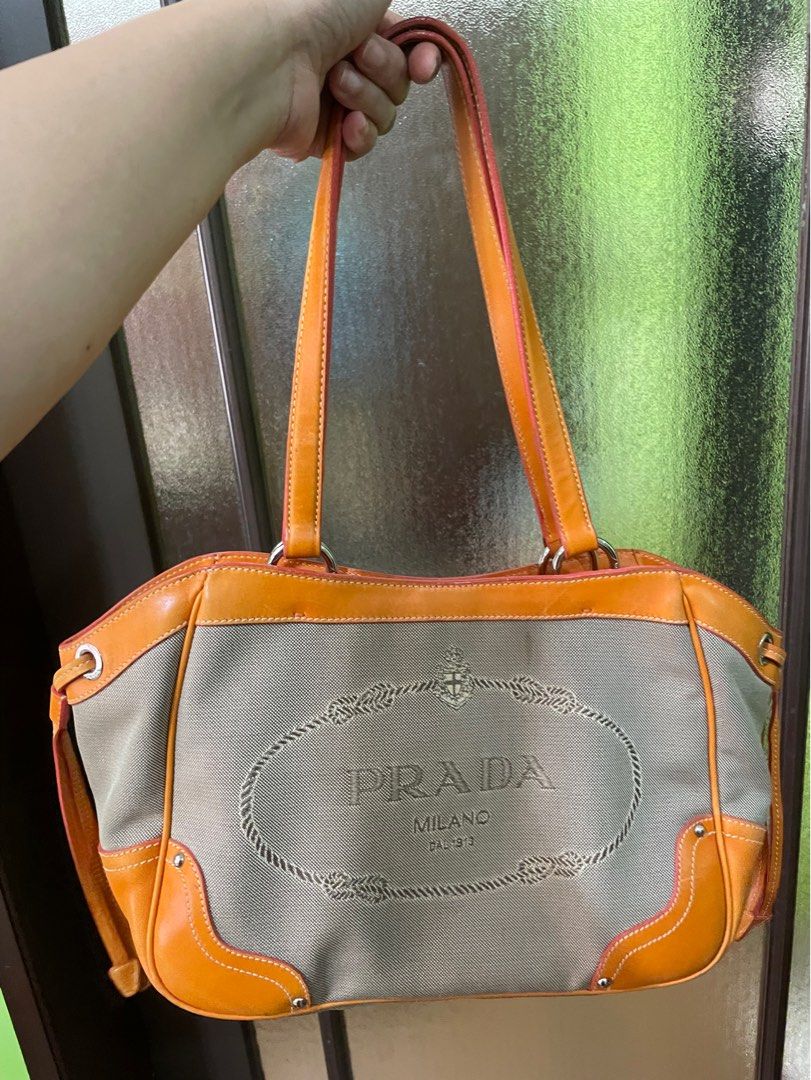Original Prada Canvas Shoulder Bag (Category: Luxury Bags & Wallets) located in Quezon City. Submitted by cglui_152 (Listing ID 1306507463, Image 2). Description: Please take note that seller will not respond to low ballers; the price reflects the condition of the bag. Guaranteed original, refer to the photos for the actual condition of the bag and expect some imperfection or noticeable signs of usage. .