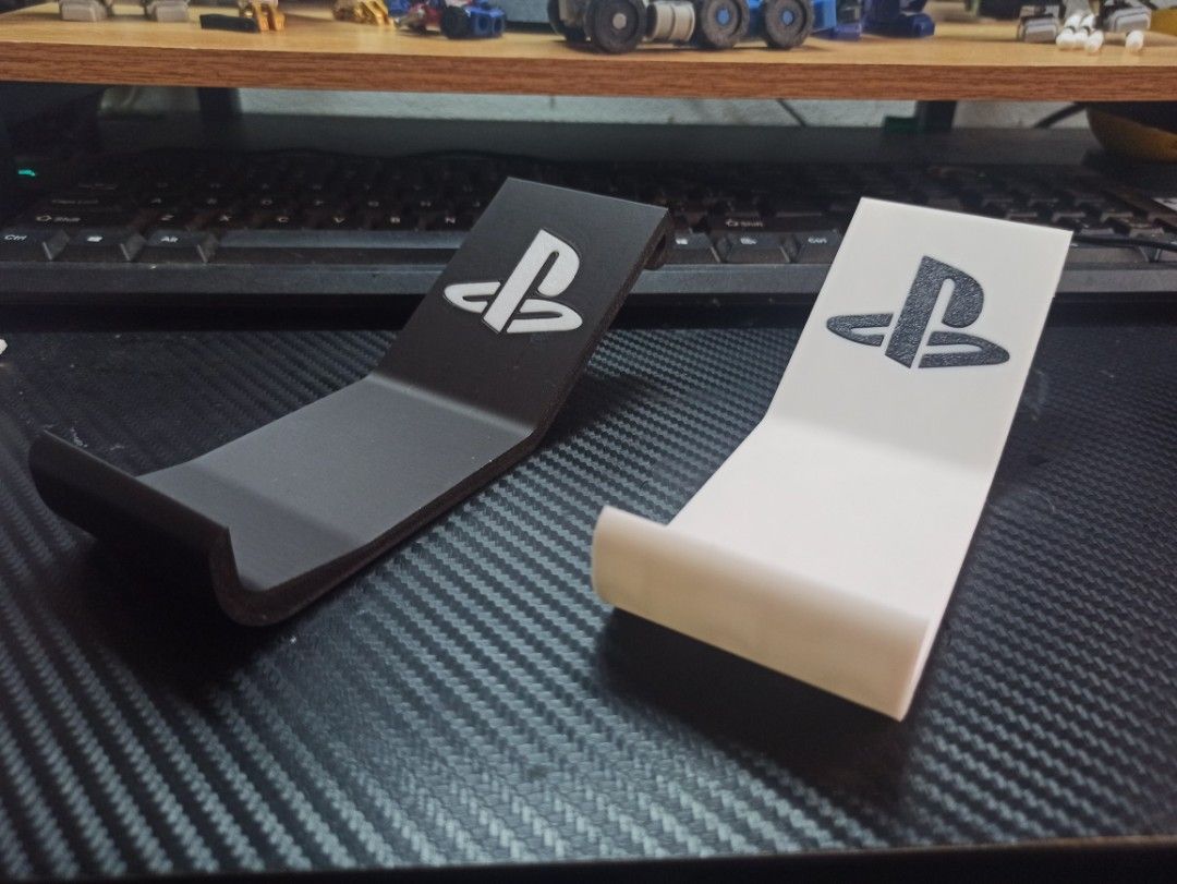 Ps5 controller holder (Category: Controllers) located in Kota Bharu. Submitted by mr.sekut (Listing ID 1306426424, Image 3). Description: 3d printed ps5 controller holder using PLA. Can request for other colours..