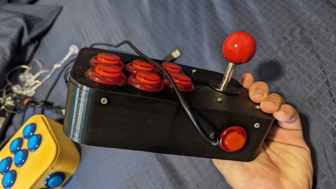 USB Arcade Console controller (Category: Controllers) located in Singapore. Submitted by twelve_trees (Listing ID 1306390274, Image 3). Description: 3D Printed USB Arcade Controller, 15 for 1, 25 for both! very fun to use with emulator when you're playing arcade games like MVC2, street fighter etc. DIY assembled because I used to be into making and 3d printing things. letting go to clear space and let someone else enjoy this..